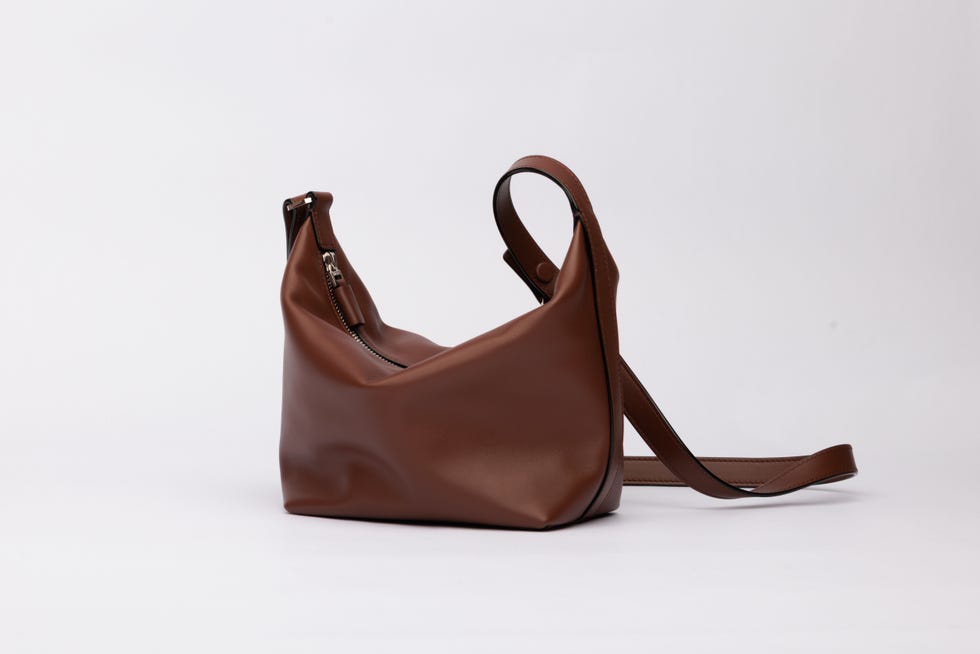 stylish brown leather shoulder bag with a zippered top and adjustable strap